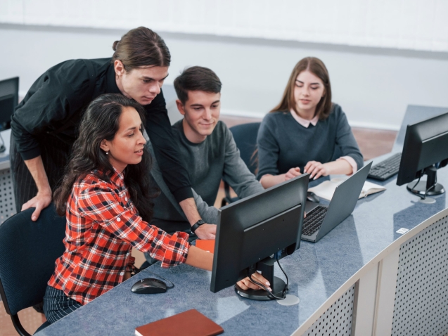 Look at this. Group of young people in casual clothes working in the modern office.